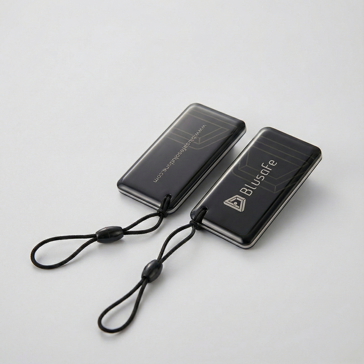 Two black Blusafe RFID key fobs with attachment loops
